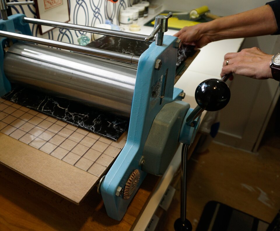 Kate at her etching press in the studio